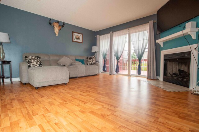 2043 Coleman Dr Unit 6F, Columbus, OH 43235 - living room featuring wood finished floors and a fireplace