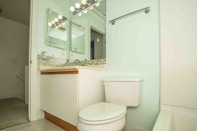 2043 Coleman Dr Unit 6F, Columbus, OH 43235 - bathroom featuring toilet, vanity, and backsplash
