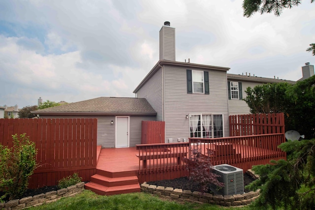 2043 Coleman Dr Unit 6F, Columbus, OH 43235 - back of property featuring central air condition unit, a chimney, and a wooden deck
