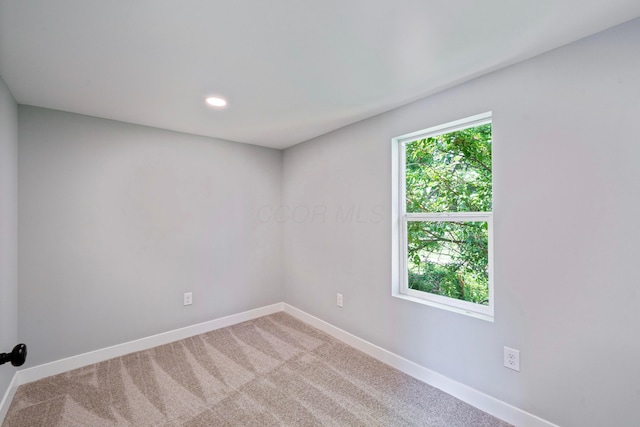 1275 Wager St, Columbus, OH 43206 - carpeted empty room with baseboards and recessed lighting