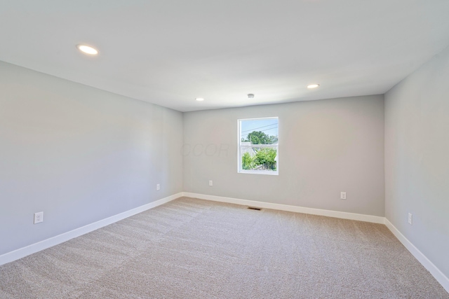 1275 Wager St, Columbus, OH 43206 - empty room with recessed lighting and carpet