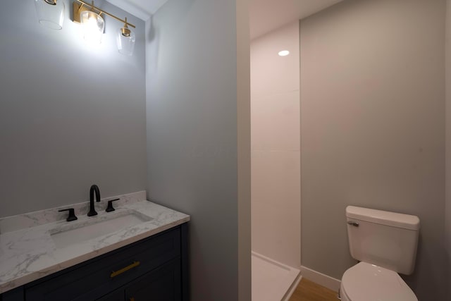 1275 Wager St, Columbus, OH 43206 - bathroom with a walk in shower, vanity, and wood finished floors