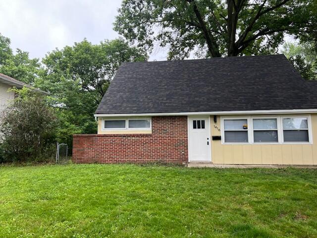 1416 Benson Dr, Columbus, OH 43227 - view of front facade with a shingled roof and a front lawn