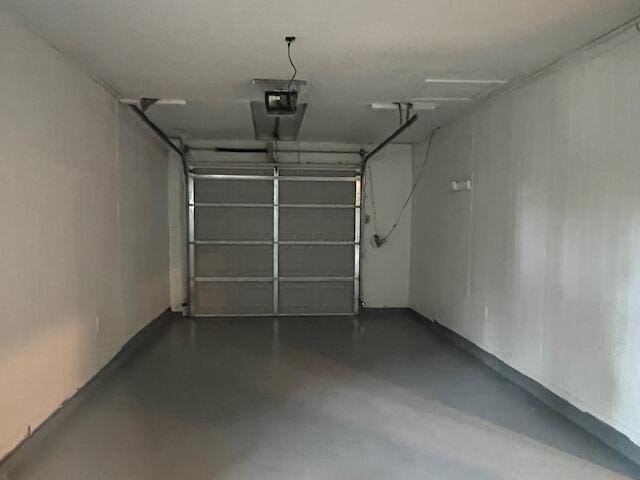 1416 Benson Dr, Columbus, OH 43227 - garage featuring a garage door opener