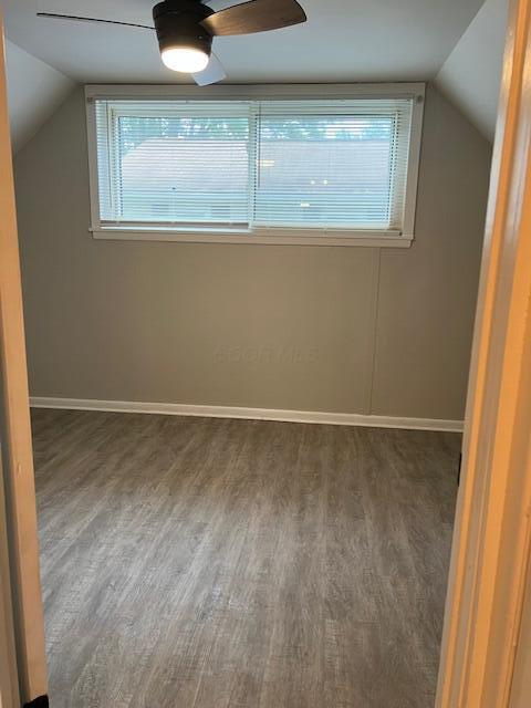 1416 Benson Dr, Columbus, OH 43227 - additional living space with wood finished floors, vaulted ceiling, healthy amount of natural light, and a ceiling fan