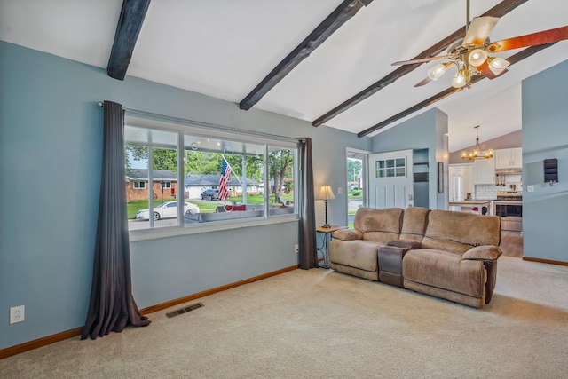 5452 Roche Ct W, Columbus, OH 43229 - living room with carpet flooring, ceiling fan, and a chandelier