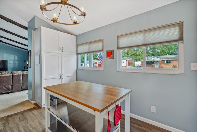 5452 Roche Ct W, Columbus, OH 43229 - dining space with a chandelier, lofted ceiling, and dark wood-type flooring