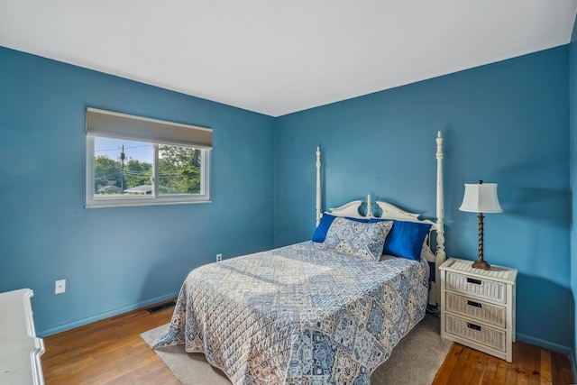 5452 Roche Ct W, Columbus, OH 43229 - bedroom featuring hardwood / wood-style flooring and baseboards