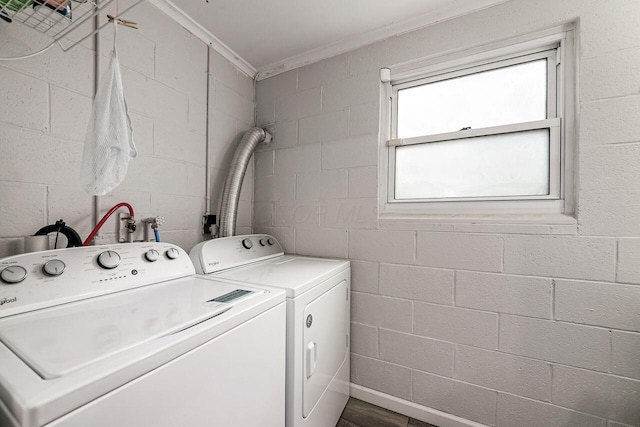 6563 Karl Rd, Columbus, OH 43229 - washroom with washer and clothes dryer, ornamental molding, and concrete block wall