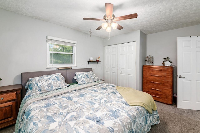6563 Karl Rd, Columbus, OH 43229 - carpeted bedroom with a closet, ceiling fan, and a textured ceiling