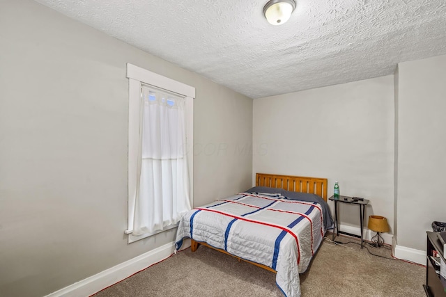 972 E 12th Ave, Columbus, OH 43211 - bedroom with a textured ceiling and carpet floors
