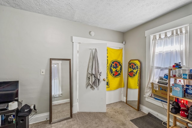 972 E 12th Ave, Columbus, OH 43211 - bedroom featuring carpet flooring and a textured ceiling