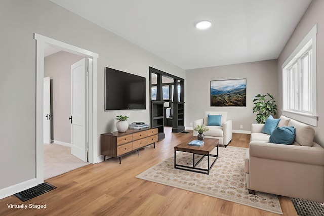 704 N Detroit St, Bellefontaine, OH 43311 - living room featuring light wood finished floors and baseboards
