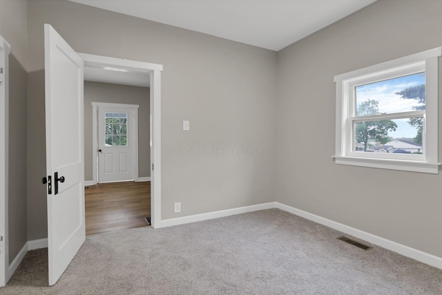 704 N Detroit St, Bellefontaine, OH 43311 - spare room featuring carpet and baseboards