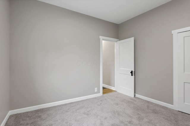704 N Detroit St, Bellefontaine, OH 43311 - unfurnished room featuring carpet floors and baseboards
