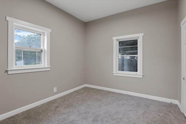 704 N Detroit St, Bellefontaine, OH 43311 - empty room with carpet and baseboards