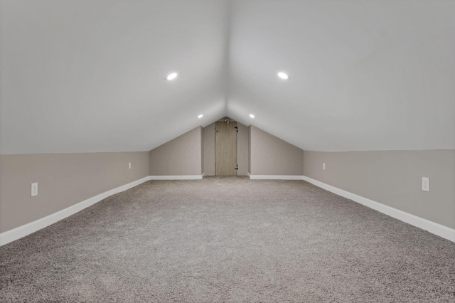 704 N Detroit St, Bellefontaine, OH 43311 - bonus room featuring lofted ceiling, baseboards, light carpet, and recessed lighting