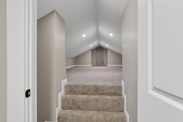 704 N Detroit St, Bellefontaine, OH 43311 - staircase with carpet flooring, vaulted ceiling, baseboards, and recessed lighting
