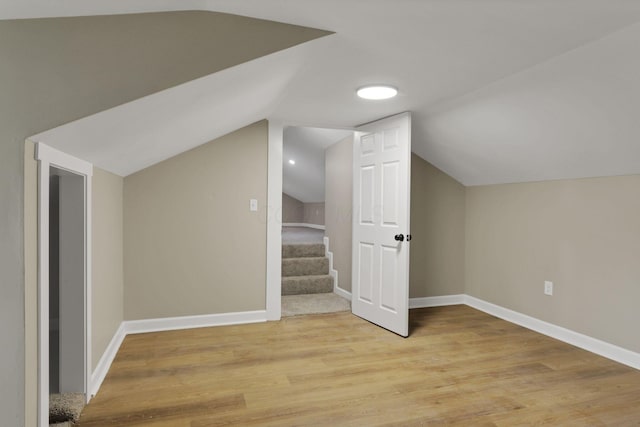 704 N Detroit St, Bellefontaine, OH 43311 - bonus room featuring vaulted ceiling, light wood-type flooring, and baseboards