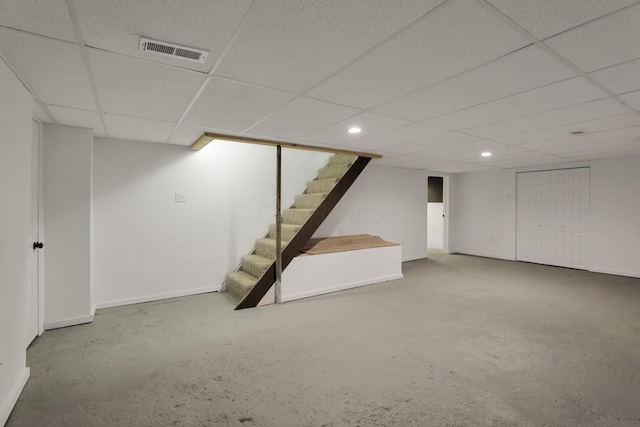 704 N Detroit St, Bellefontaine, OH 43311 - finished below grade area featuring stairs, a paneled ceiling, recessed lighting, and baseboards