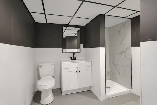 704 N Detroit St, Bellefontaine, OH 43311 - full bathroom with toilet, a stall shower, vanity, concrete flooring, and a paneled ceiling