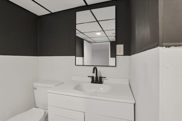 704 N Detroit St, Bellefontaine, OH 43311 - half bathroom featuring toilet, vanity, recessed lighting, and a paneled ceiling