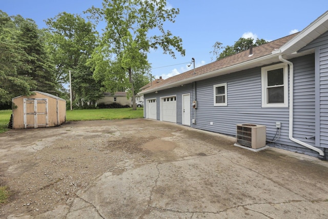 704 N Detroit St, Bellefontaine, OH 43311 - garage with central air condition unit and a shed
