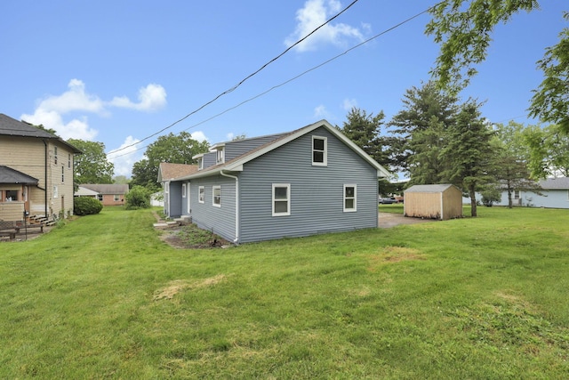 704 N Detroit St, Bellefontaine, OH 43311 - rear view of house featuring a lawn