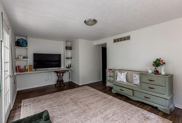 439 Dartmouth Cir Unit 30, Cincinnati, OH 45244 - living area with wood finished floors, a textured ceiling, and baseboards