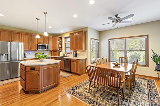 5839 Ketch St, Lewis Center, OH 43035 - kitchen with appliances with stainless steel finishes, light countertops, decorative backsplash, light wood-type flooring, and recessed lighting