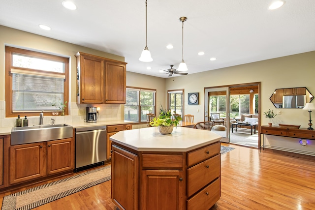 5839 Ketch St, Lewis Center, OH 43035 - kitchen with dishwasher, a ceiling fan, light wood-style floors, recessed lighting, and tasteful backsplash