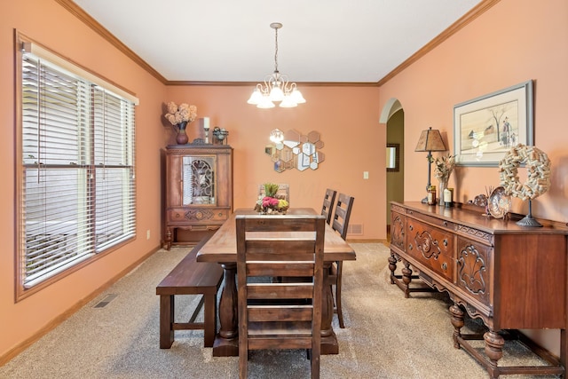 5839 Ketch St, Lewis Center, OH 43035 - dining space with arched walkways, light colored carpet, a chandelier, and ornamental molding