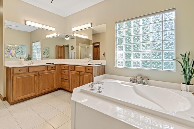 5839 Ketch St, Lewis Center, OH 43035 - full bathroom with ceiling fan, a garden tub, a stall shower, tile patterned flooring, and double vanity