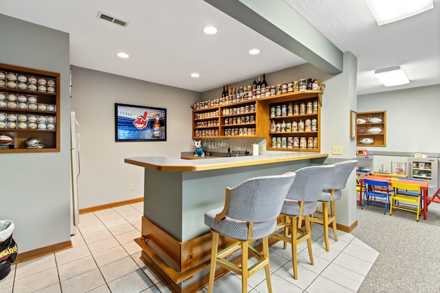 5839 Ketch St, Lewis Center, OH 43035 - community bar area with freestanding refrigerator, light tile patterned floors, and recessed lighting