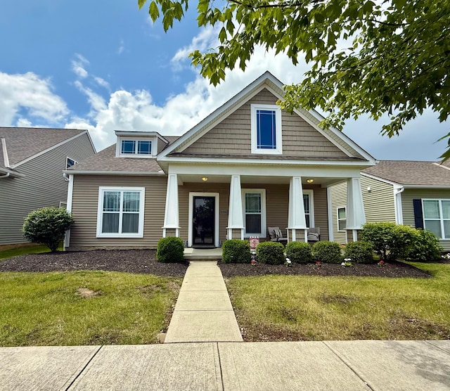 2210 Tournament Way, Grove City, OH 43123 - craftsman inspired home with covered porch, a front lawn, and a shingled roof