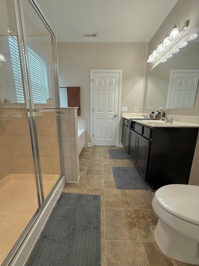 2210 Tournament Way, Grove City, OH 43123 - bathroom featuring vanity, a shower stall, a garden tub, and toilet