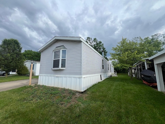 13 Birch Row Dr, Delaware, OH 43015 - view of side of property featuring a lawn