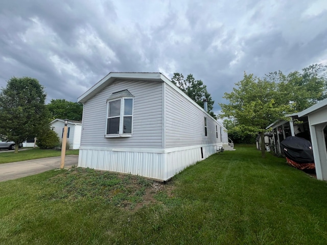 13 Birch Row Dr, Delaware, OH 43015 - view of side of property featuring a yard