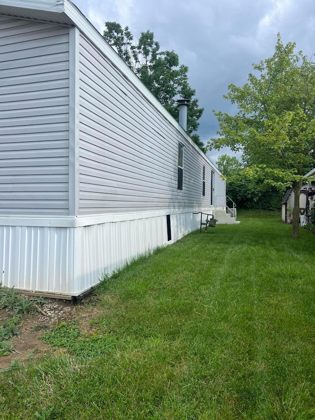 13 Birch Row Dr, Delaware, OH 43015 - view of property exterior with a yard