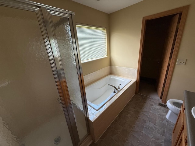 3126 Zach Ct, Columbus, OH 43219 - full bath with a stall shower, a garden tub, vanity, and toilet