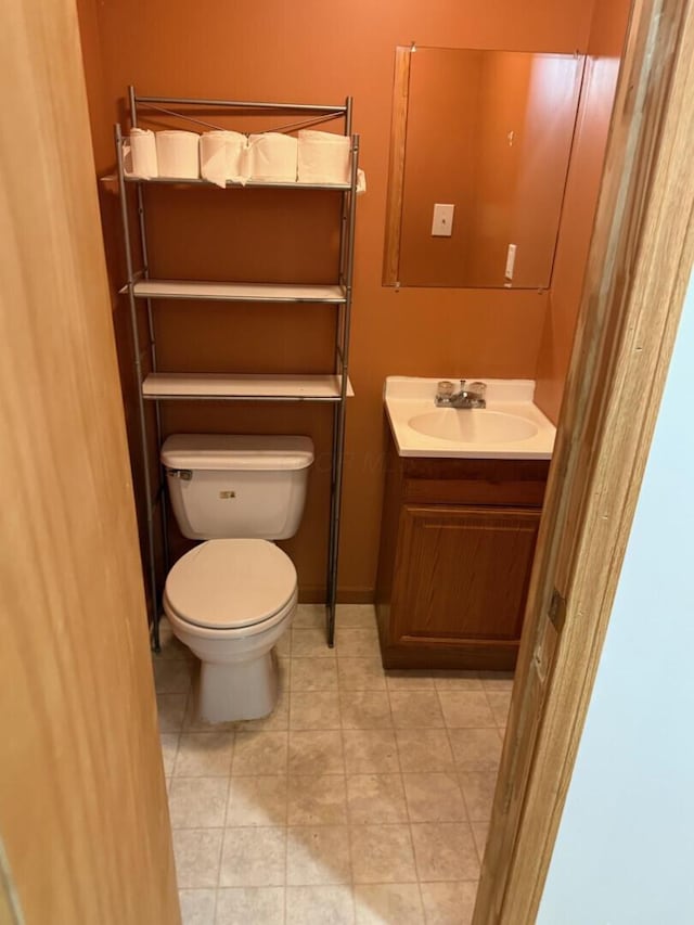 3126 Zach Ct, Columbus, OH 43219 - half bathroom with vanity, toilet, and tile patterned floors