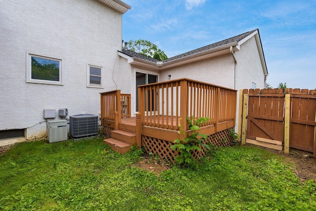 2655 Blendon Woods Blvd Unit 2644, Columbus, OH 43231 - rear view of property featuring cooling unit, stucco siding, a deck, and a gate