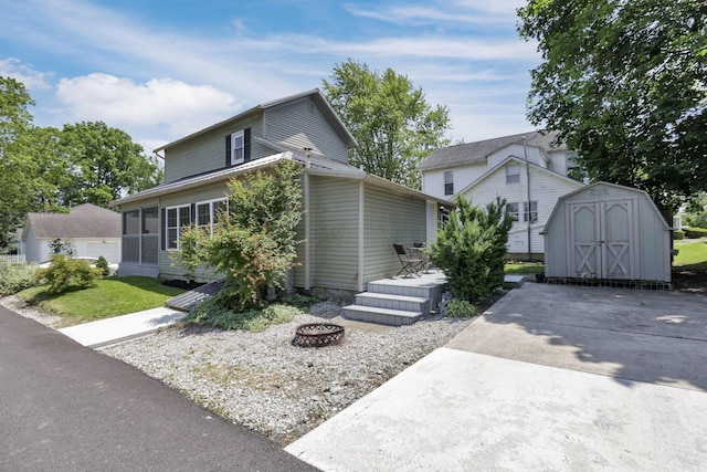 107 N Factory St, Baltimore, OH 43105 - view of front of property featuring an outdoor fire pit, a storage unit, and a deck