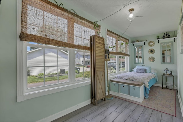 107 N Factory St, Baltimore, OH 43105 - bedroom with baseboards and wood tiled floors