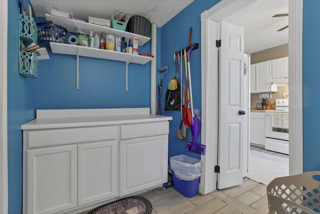 107 N Factory St, Baltimore, OH 43105 - laundry area with a textured ceiling and a ceiling fan