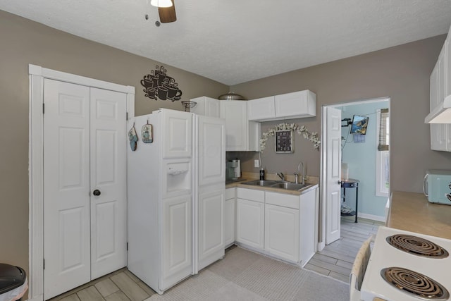 107 N Factory St, Baltimore, OH 43105 - kitchen featuring white appliances, white cabinets, light countertops, and a textured ceiling