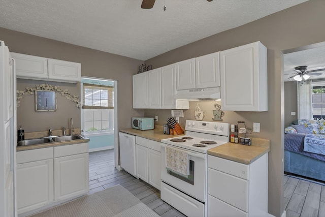 107 N Factory St, Baltimore, OH 43105 - kitchen featuring white appliances, a ceiling fan, under cabinet range hood, white cabinetry, and a textured ceiling