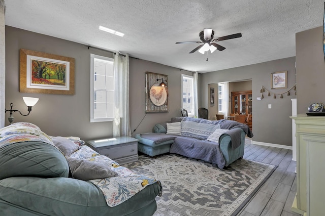 107 N Factory St, Baltimore, OH 43105 - living room featuring a ceiling fan and a textured ceiling