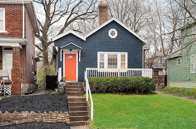 184 E Patterson Ave, Columbus, OH 43202 - view of front of house with a front yard and a chimney