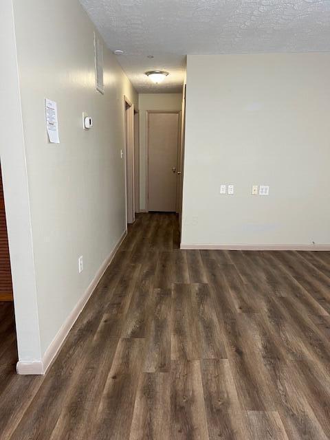 885-887 Derrer Rd, Columbus, OH 43204 - corridor featuring a textured ceiling and wood finished floors